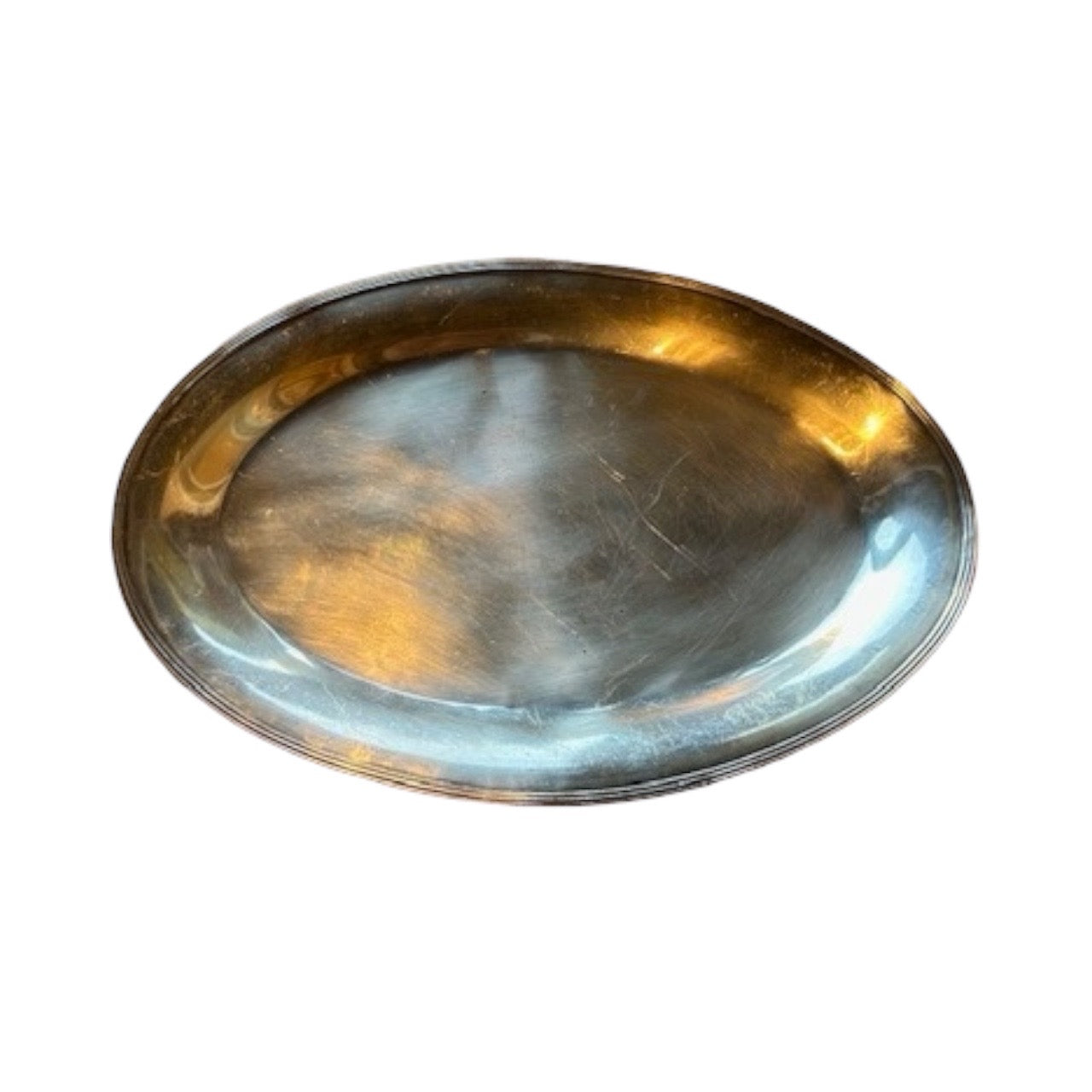 Large oval silver-plate tray with a reeded rim shown at an angle over a plain polished well.