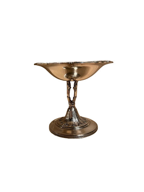 Silver plate footed compote, front profile with ornate openwork stem and fluted domed foot with beaded rim.