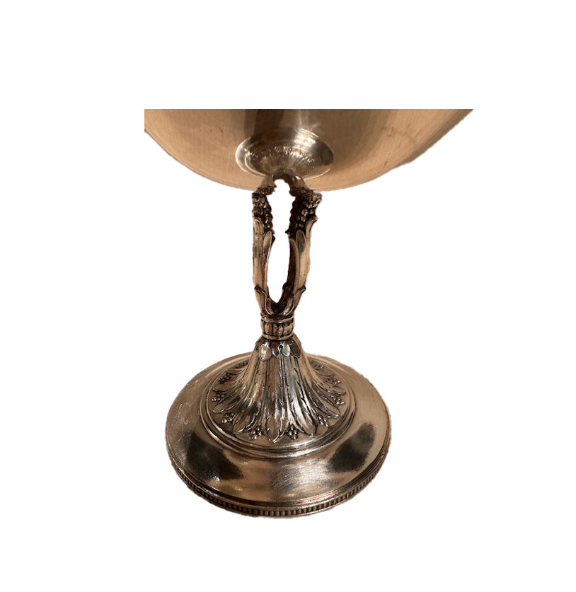 Close-up of the compote's ornate openwork stem with grape-and-leaf motifs and acanthus-decorated foot.