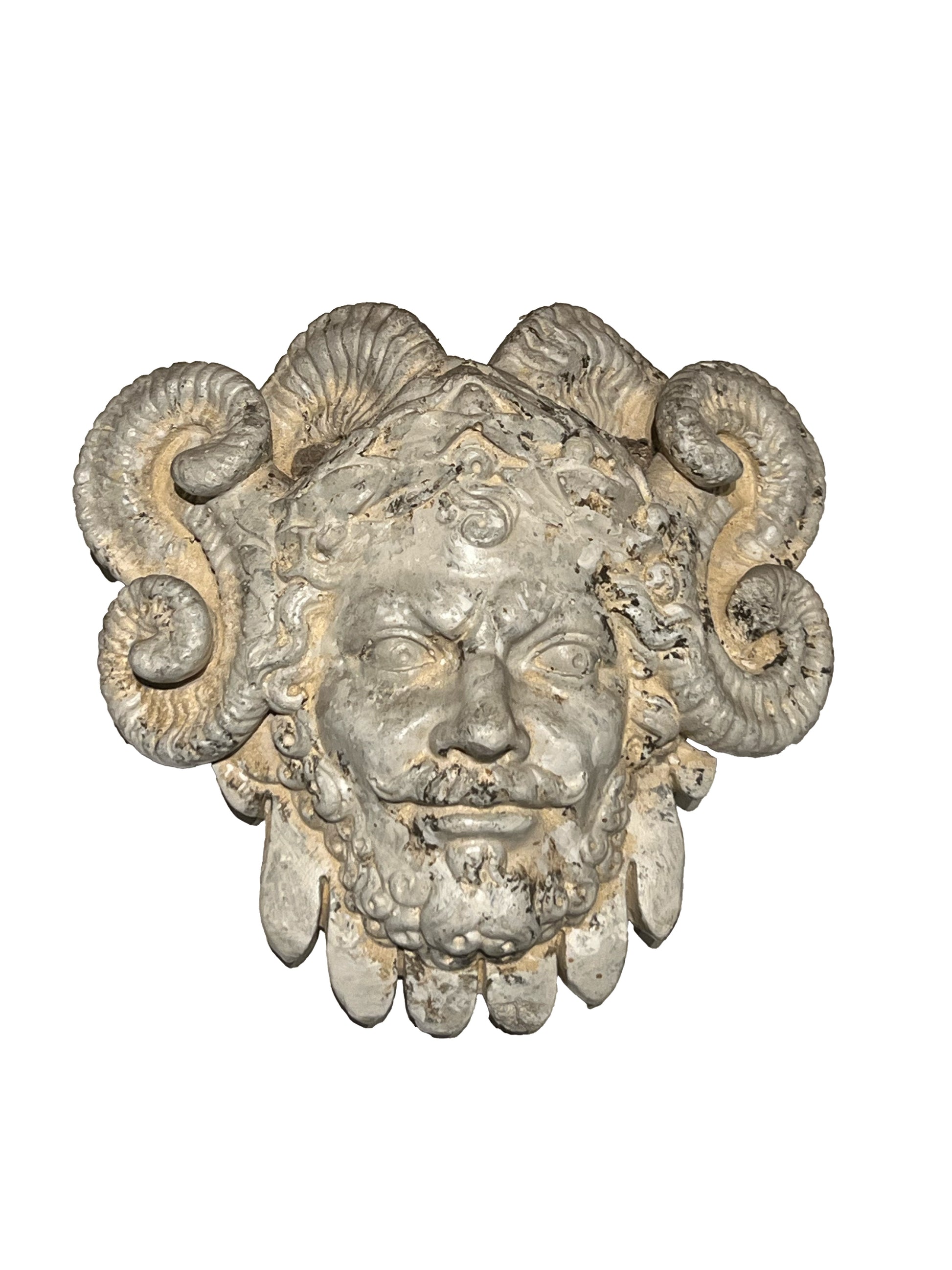 Cast concrete mascaron wall hanging, front view of bearded face with ram's horns and weathered patina.