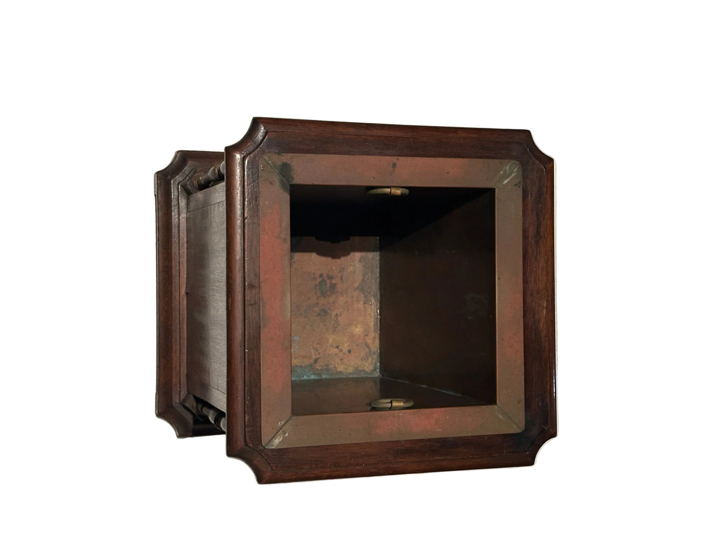 Angled view of mahogany umbrella stand with deep copper-lined square well