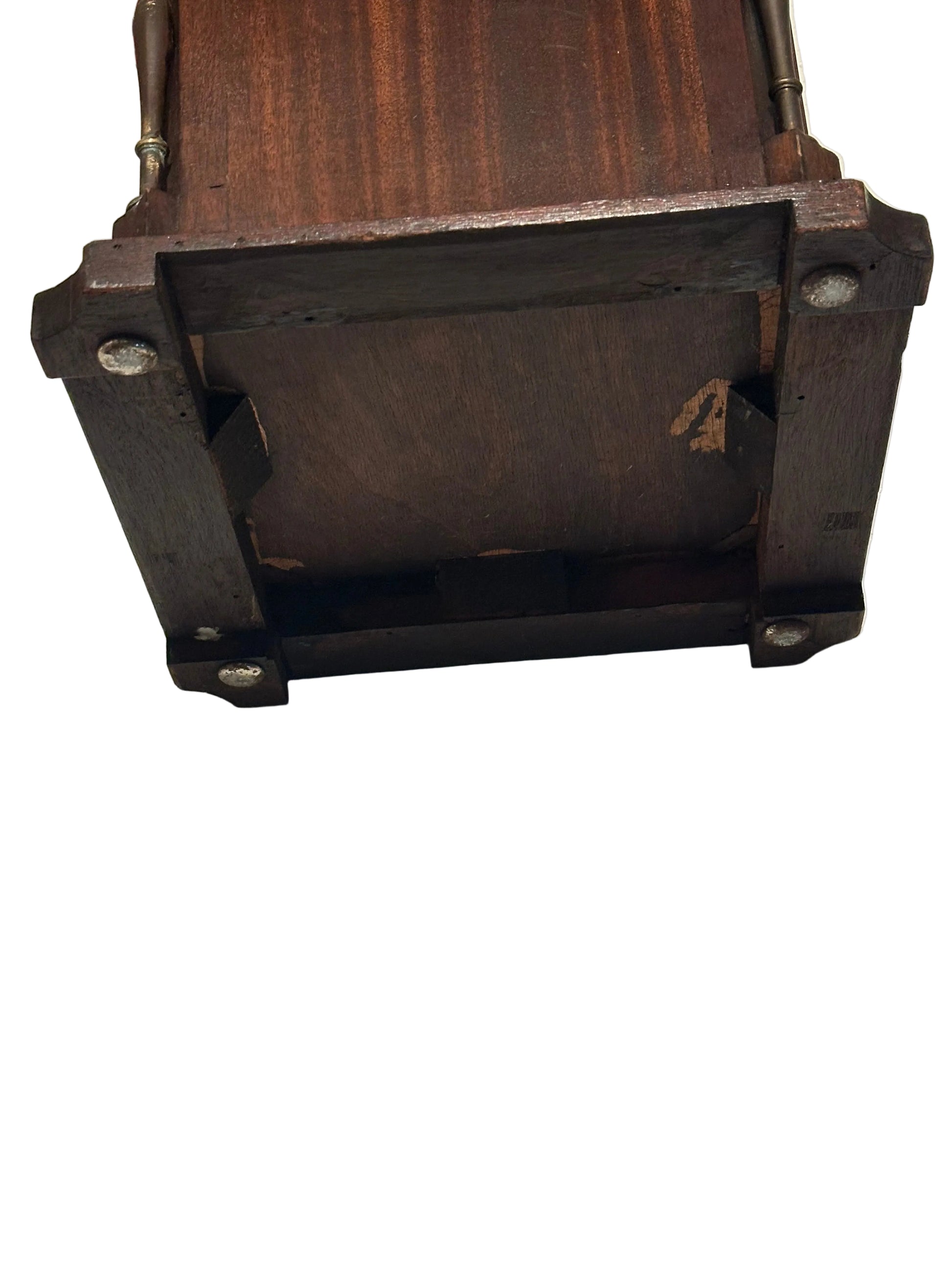 Close-up of mahogany umbrella stand base showing bracket feet and joinery underside