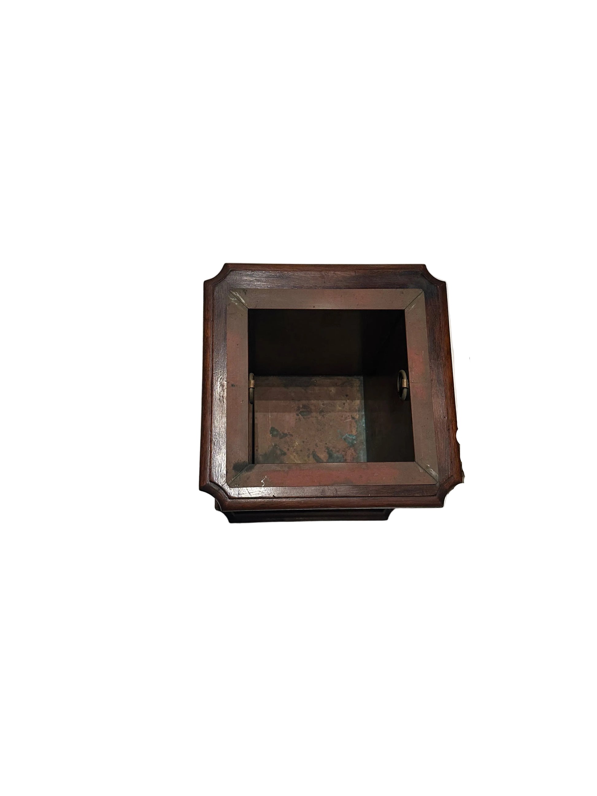 Top-down view into the square copper-lined well of the mahogany umbrella stand