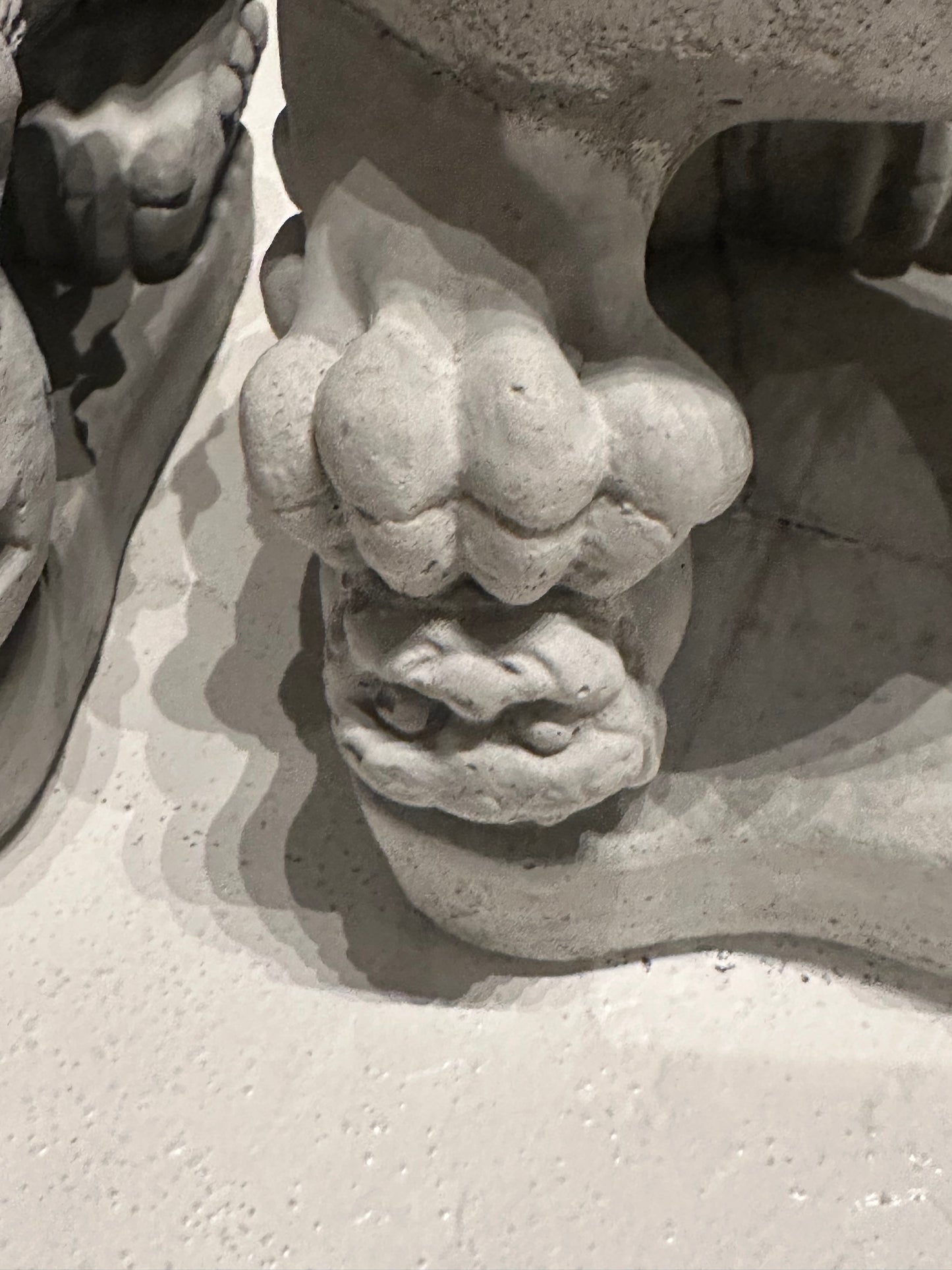 Close-up of the carved ball beneath the male Foo dog's paw