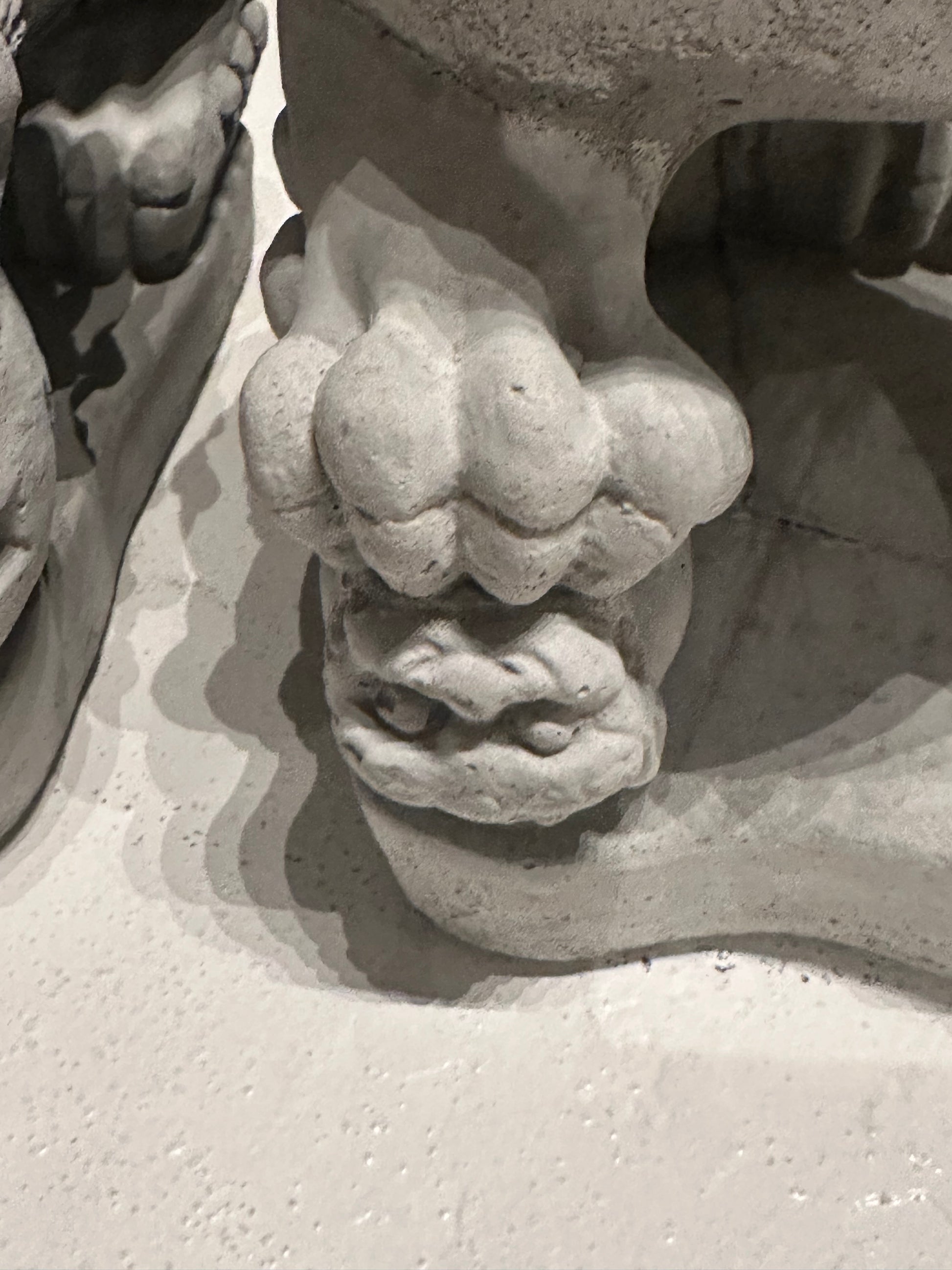 Close-up of the carved ball beneath the male Foo dog's paw