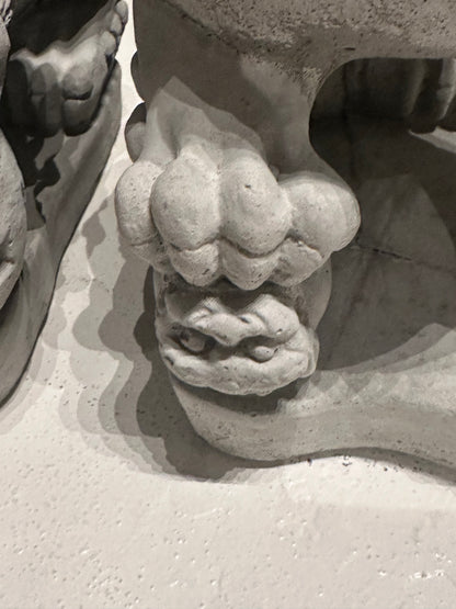Close-up of the carved ball beneath the male Foo dog's paw
