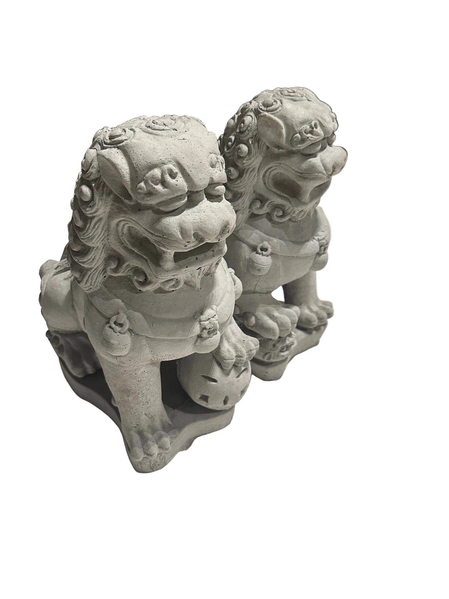 Angled view of the pair of cast concrete Foo dogs, seated guardian lions