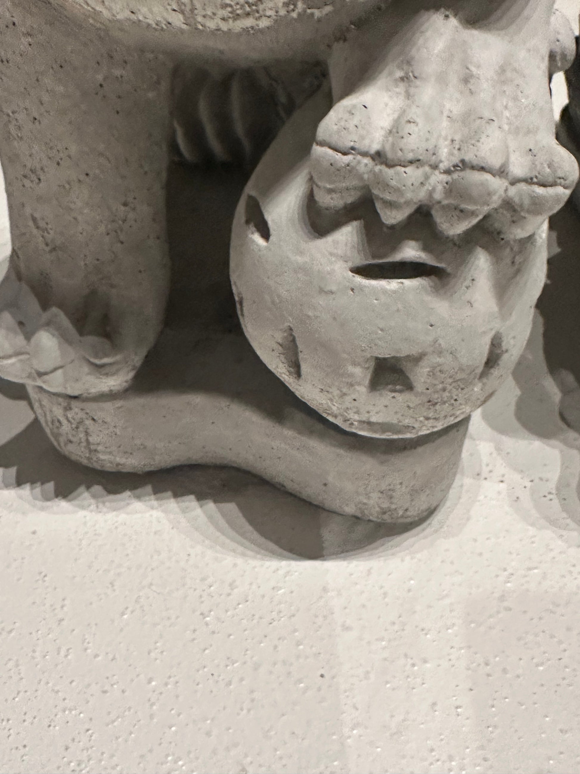 Close-up of the cub beneath the female Foo dog's paw