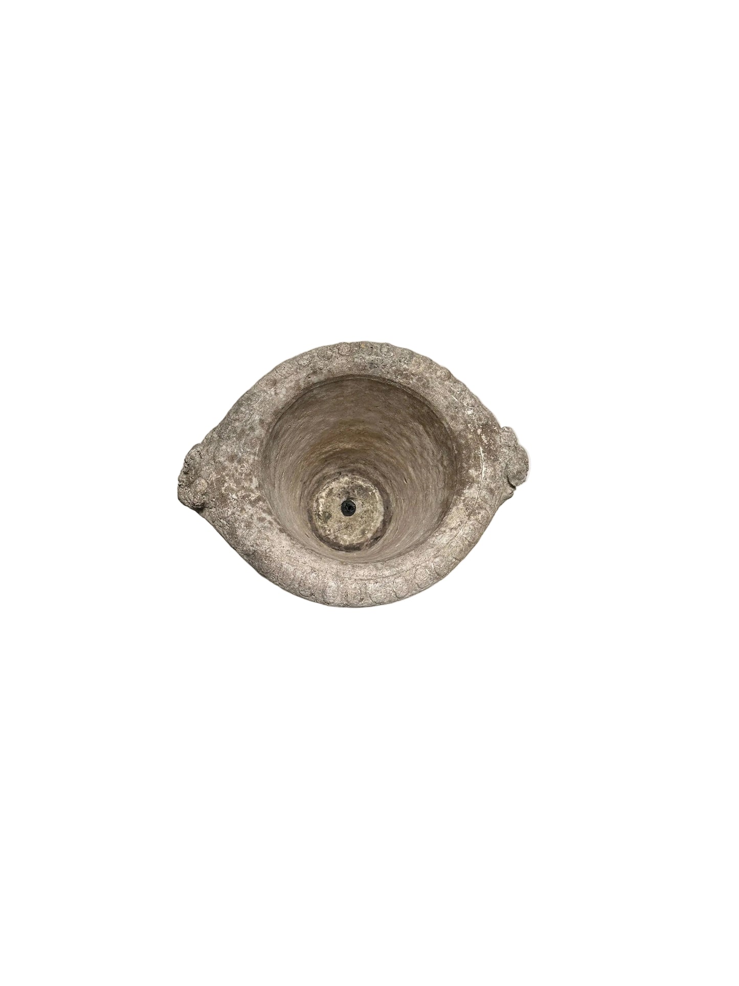 Top-down view of concrete urn rim with central drainage hole