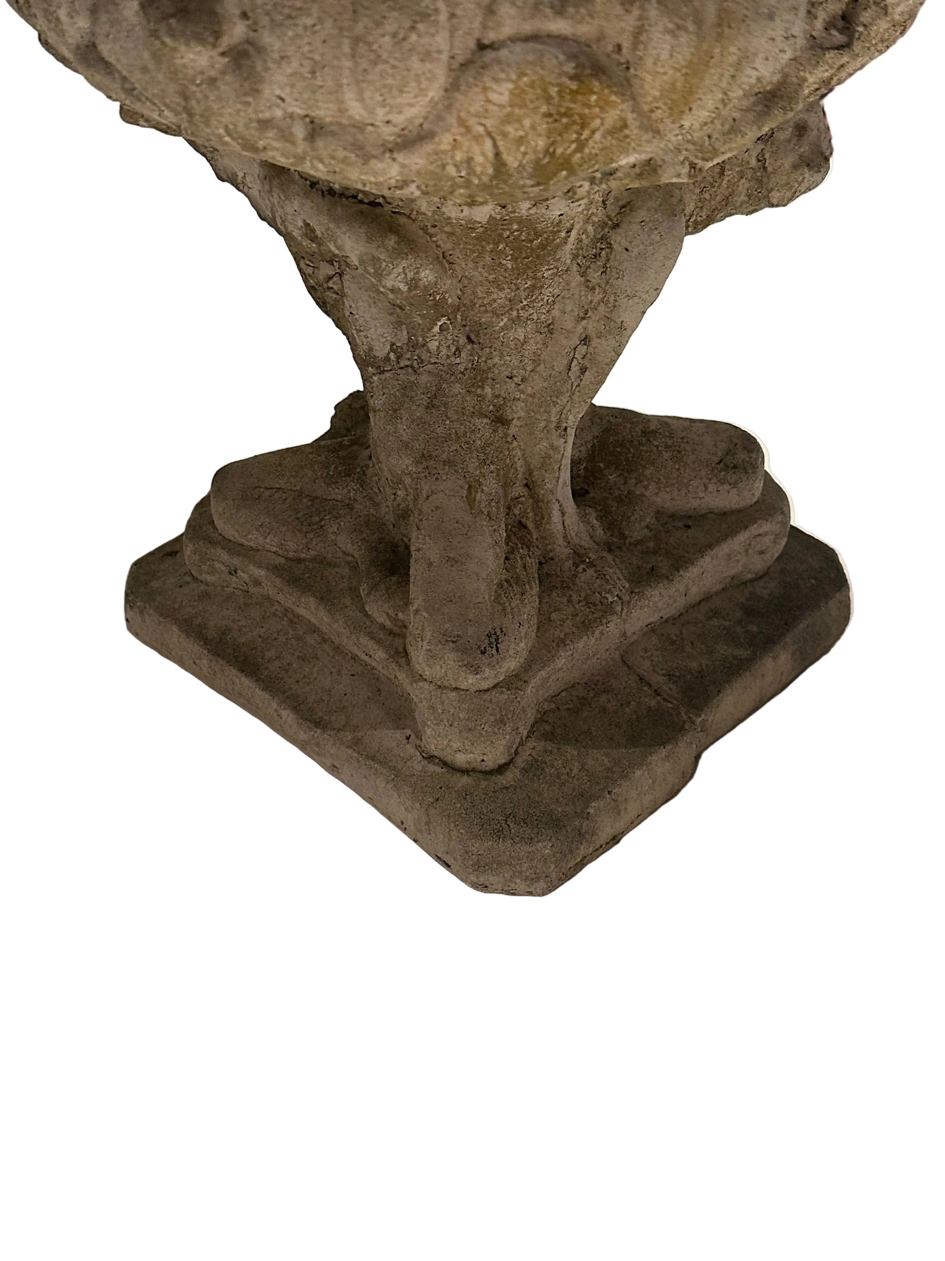 Close-up of concrete Regency urn's pedestal stem and stepped square base