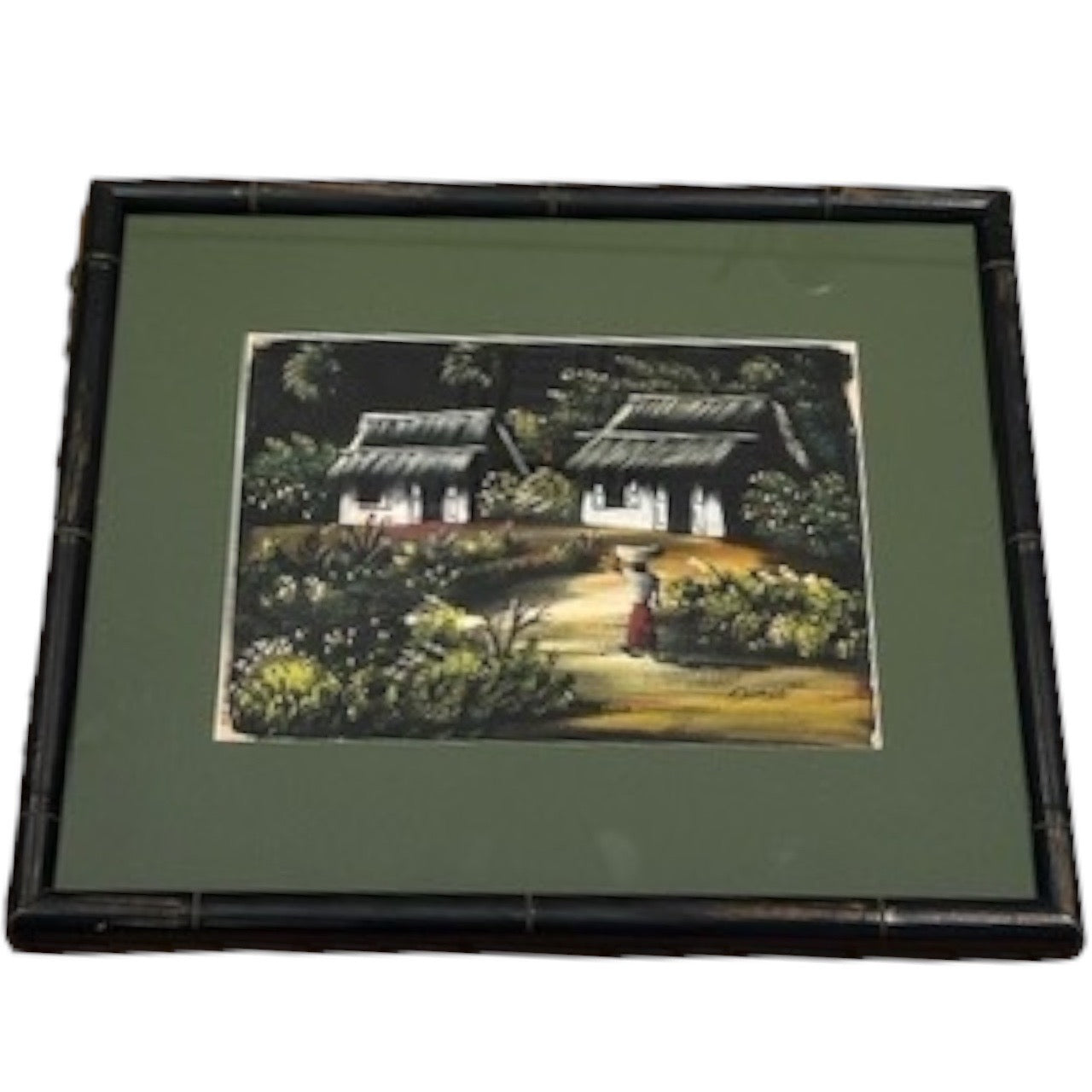 Framed tropical village painting angled left, thatched cottages and a figure, dark bamboo frame