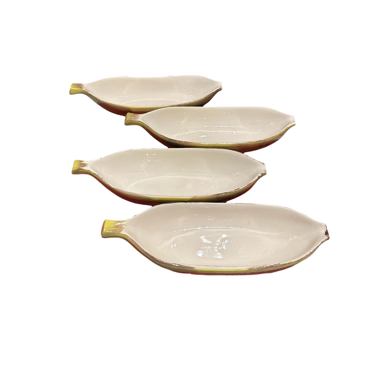Set of four vintage yellow banana-shaped ceramic split bowls, glossy cream interiors, arranged in a stepped row.