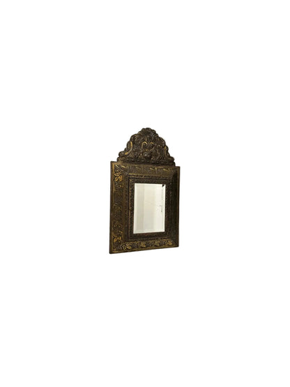Antique 1930s brass wall cabinet open, showing two embossed clothes-care brushes inside.