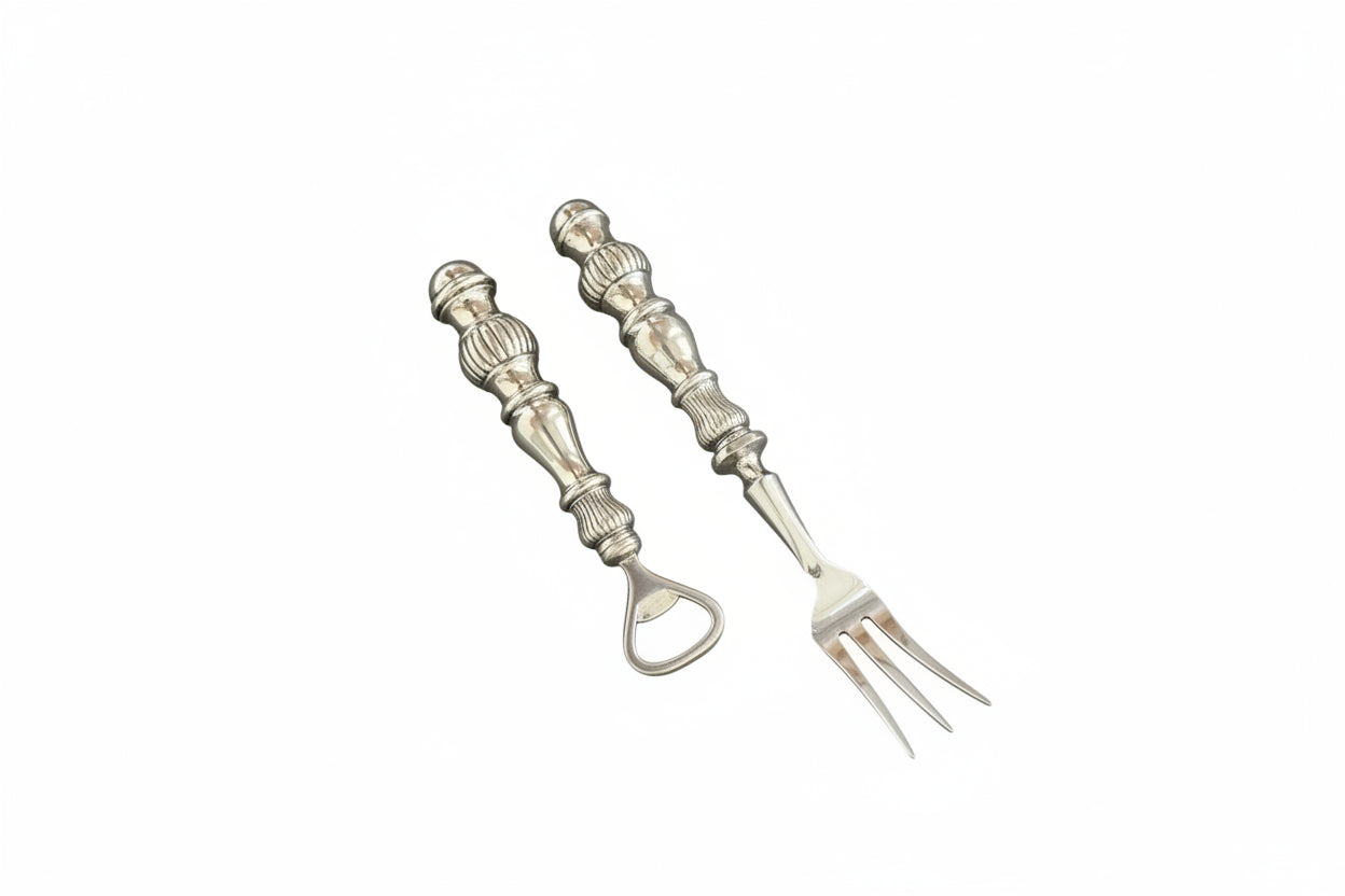 Vintage sterling silver bar tools, fluted-handle bottle opener and two-tine cocktail fork.