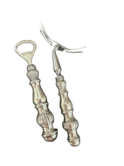 Vintage sterling fluted bar tools standing upright, bottle opener and cocktail fork heads up.