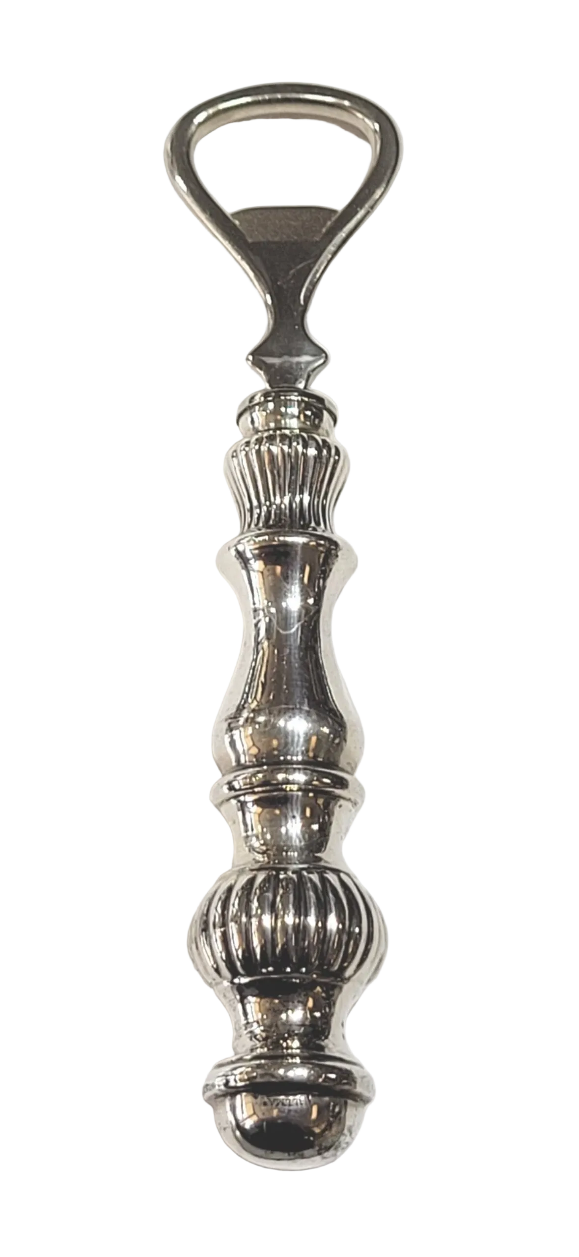 Vintage sterling silver fluted-handle bottle opener standing upright on white.