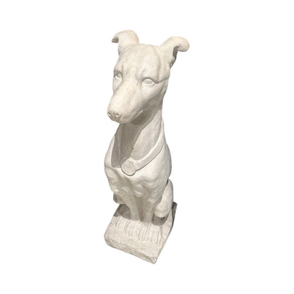 White plaster greyhound statue seated on rough-cast base with medallion collar, front view