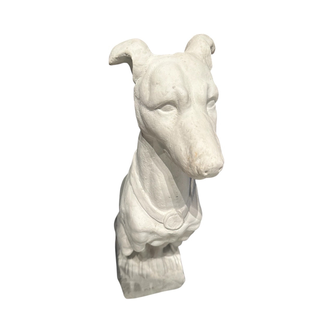 White plaster greyhound statue in profile showing head, medallion collar and seated posture