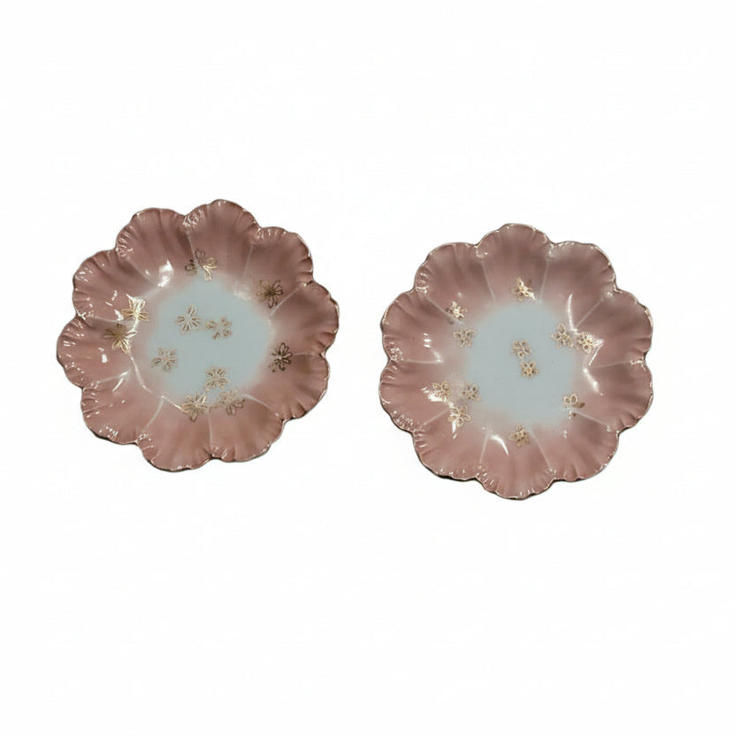 Pair of French Limoges plates with pink ruffled scalloped edges and gold floral accents