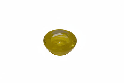 Side view of a small citron-yellow Murano-style blown glass bowl