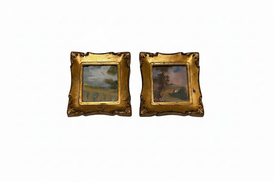 Pair of Italian gilt-framed miniature landscape paintings displayed side by side on white