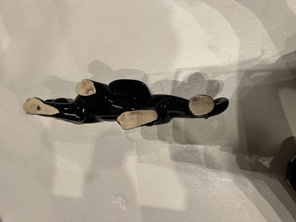 MCM McCoy black glazed ceramic panther planter, top view showing unglazed cream paw pads