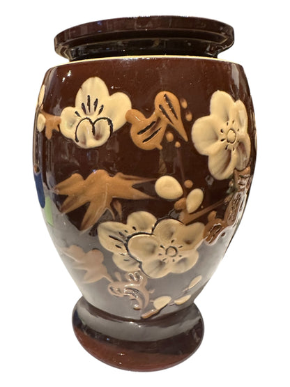 Single brown-glazed ceramic vase, close view of raised cream cherry-blossom and gilt leaf decoration