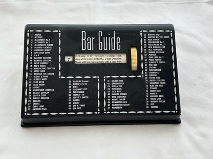 MCM black plastic Bar Guide front view listing 80 numbered cocktails with central recipe window