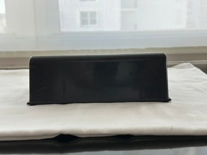 MCM Bar Guide rear view showing solid black wedge back, on white cloth
