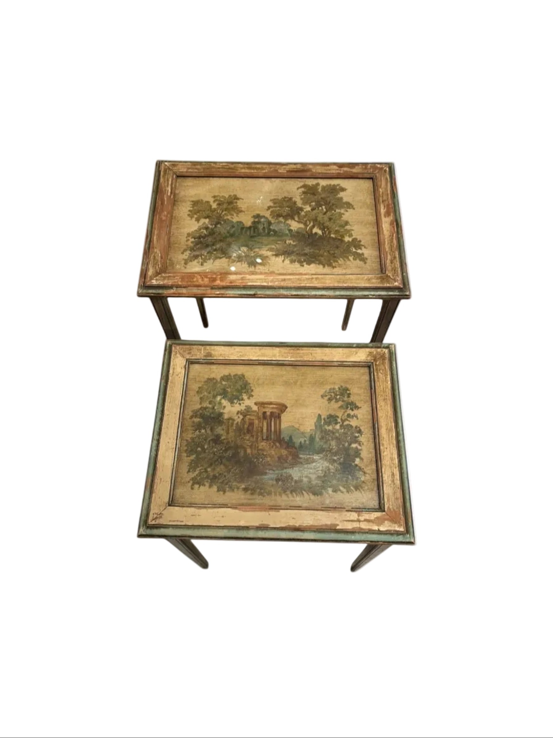 Pair of antique Venetian-style nesting tables with hand-painted pastoral landscape tops under glass.