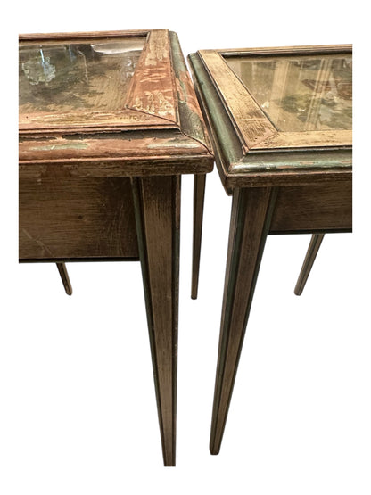 Side view of both nesting tables showing glass-covered tops and tapered legs.
