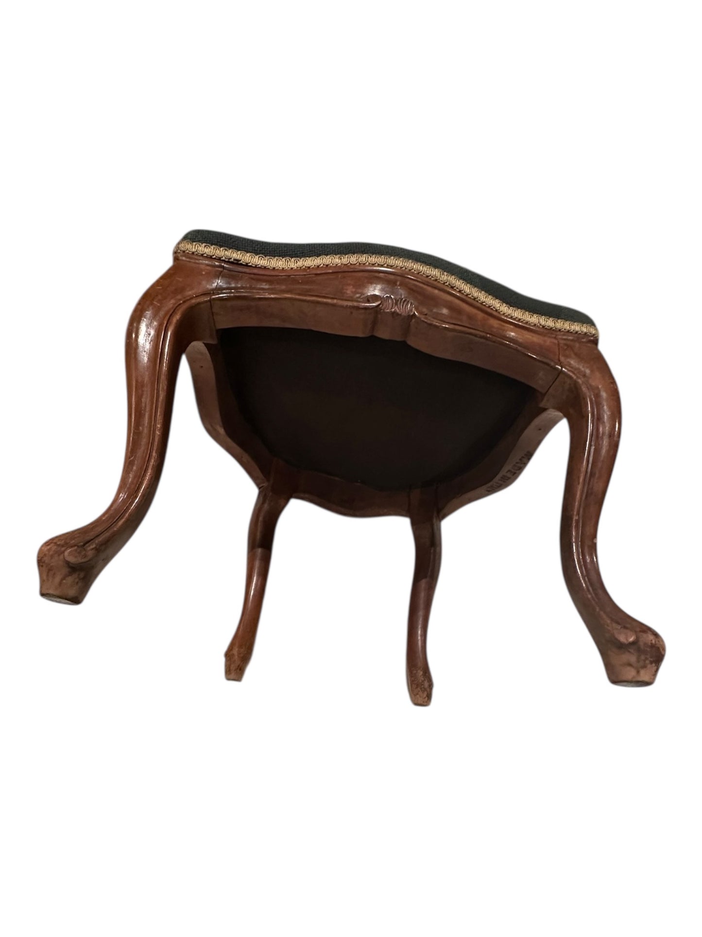 Underside of walnut boudoir chair showing cabriole legs and seat frame