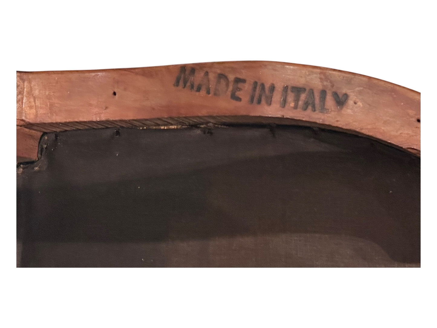 Close-up of "Made in Italy" maker's mark stamped on underside of boudoir chair