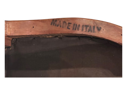 Close-up of "Made in Italy" maker's mark stamped on underside of boudoir chair