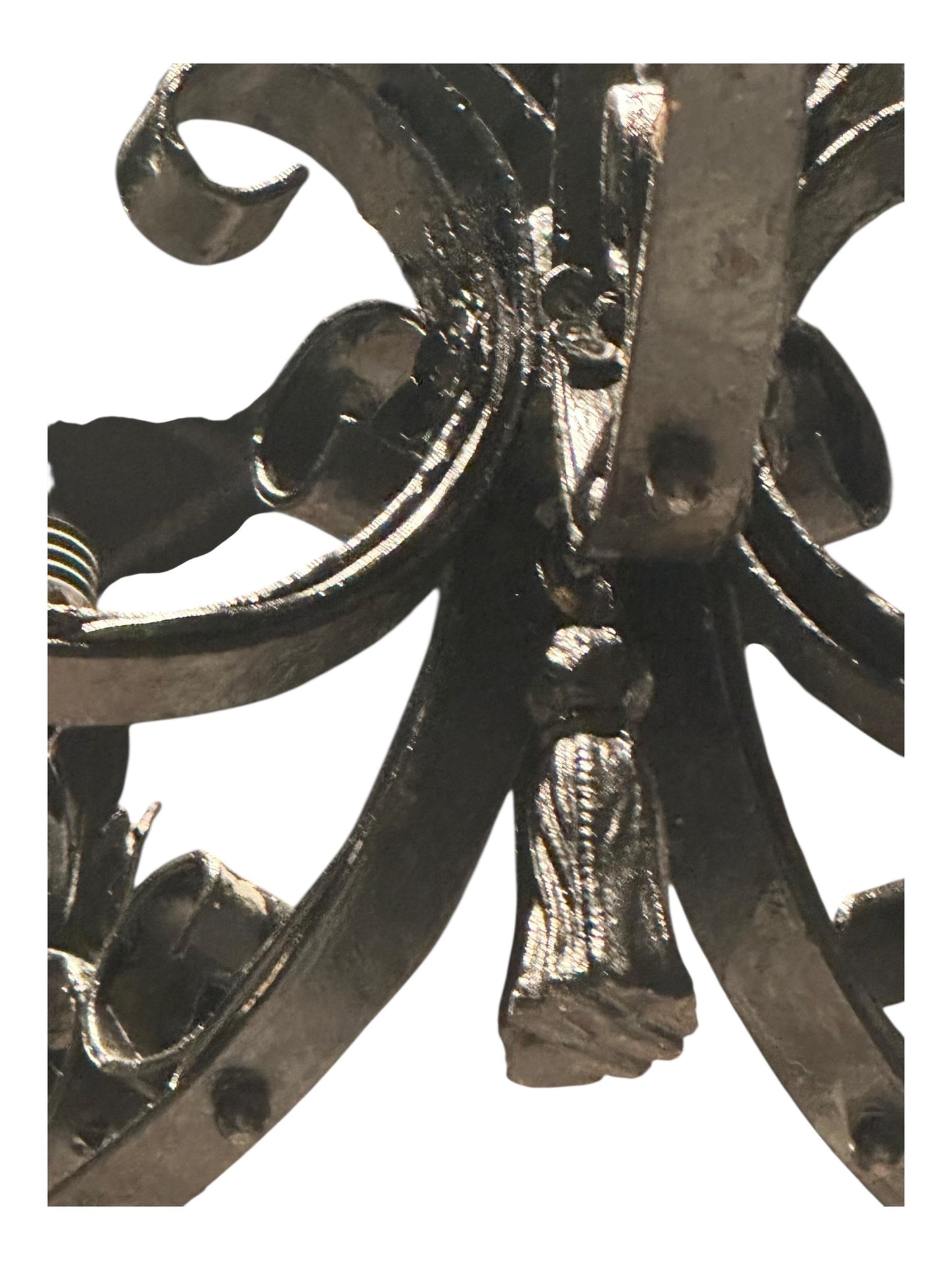 Top of black wrought iron petite chandelier showing scrolled crown and stem