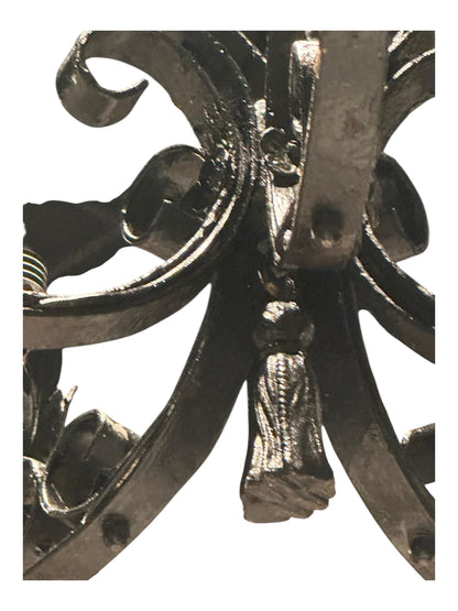 Top of black wrought iron petite chandelier showing scrolled crown and stem