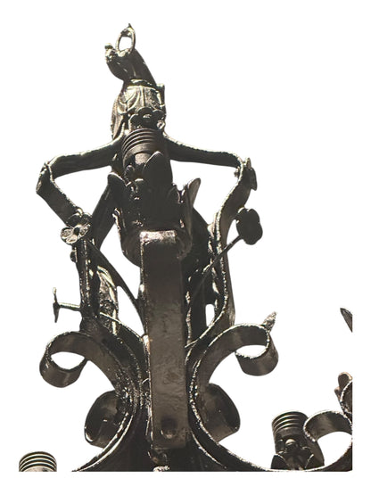 Lower scrollwork and leaf detail of black wrought iron petite chandelier