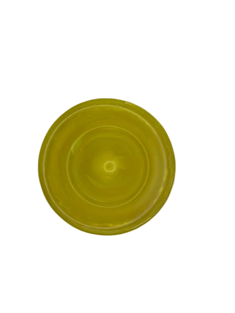 Top-down view into the citron-yellow Murano-style glass bowl showing its rounded well