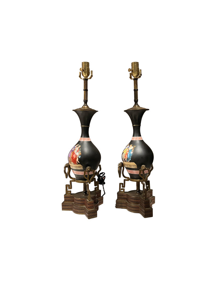 Pair of neoclassical lamps at three-quarter angle, gilt-bronze handles and stepped Greek-key bases