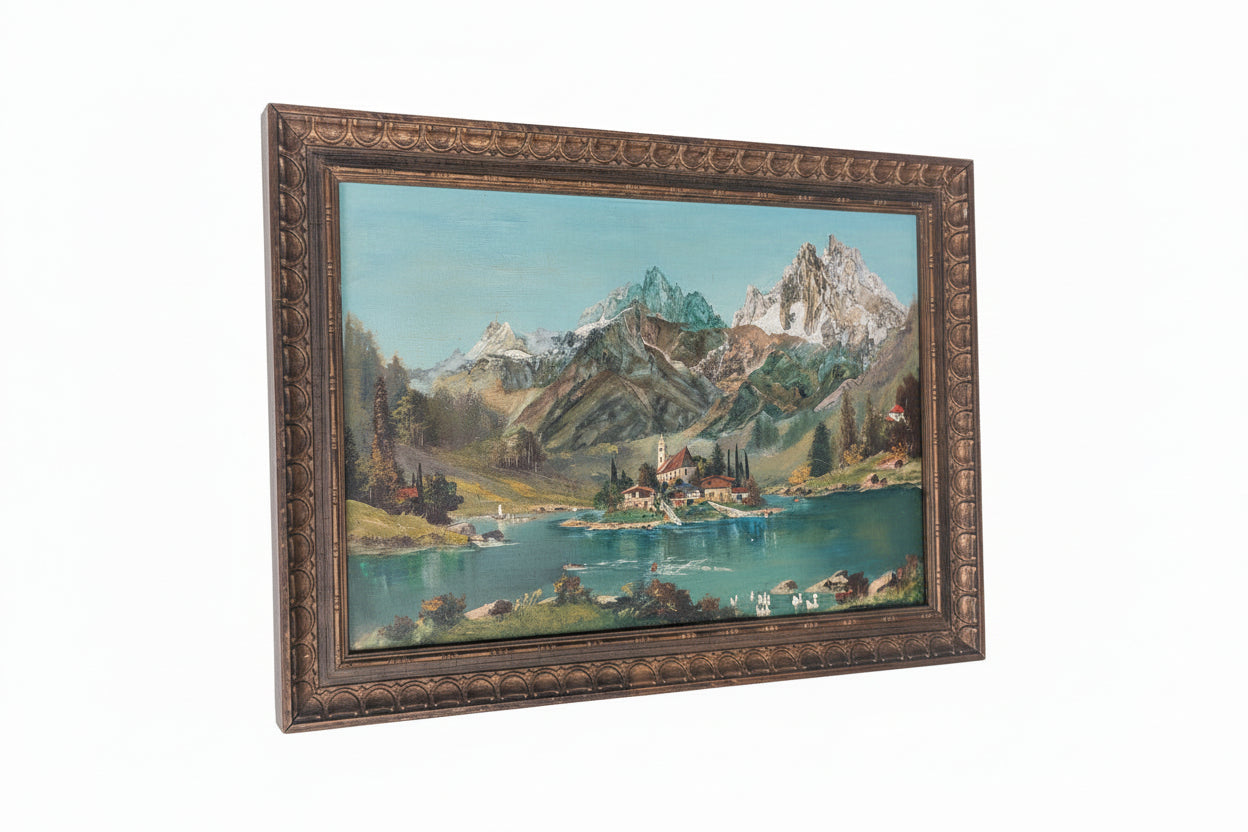 Large alpine lake landscape oil, angled view showing its ornate carved gilt wood frame.