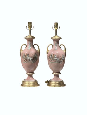 Pair of pink ceramic urn table lamps with classical chariot decoration, full front view