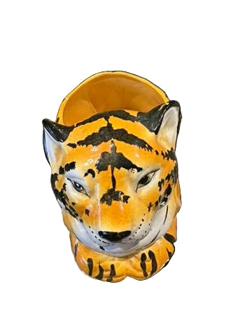 Vintage ceramic tiger planter, top view of the painted tiger face looking downward.