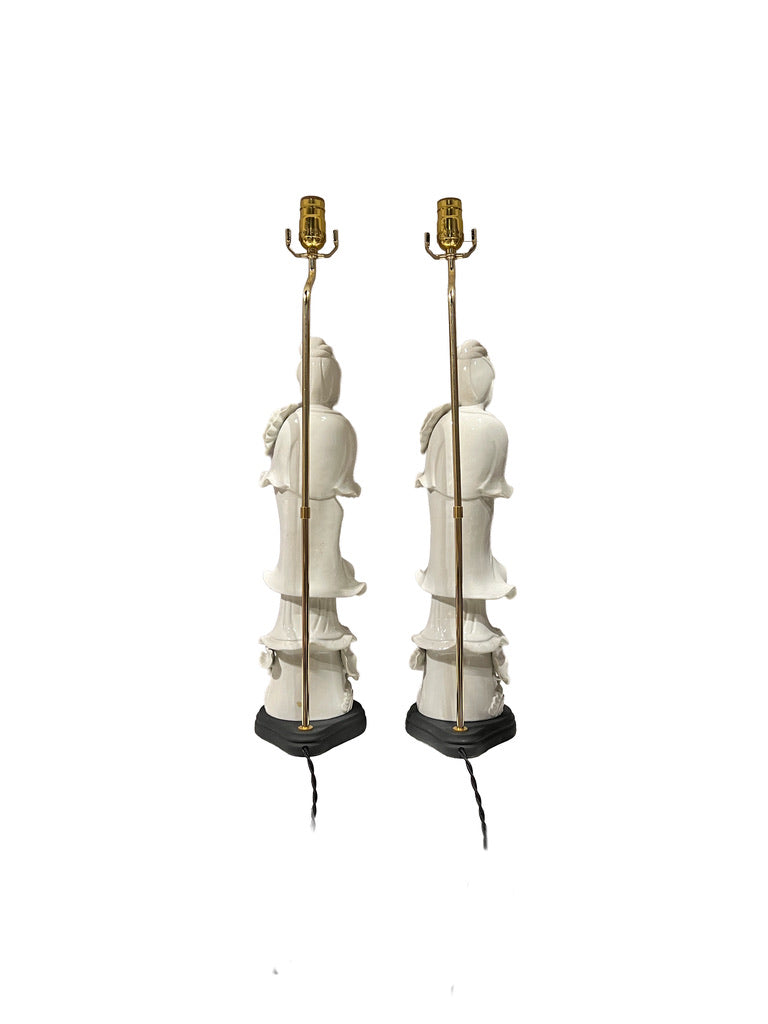 Pair of white figural table lamps, side view showing brass stems and black bases
