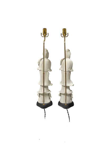 Pair of white figural table lamps, side view showing brass stems and black bases