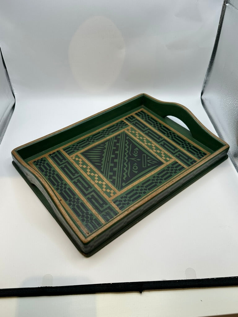 Green wood serving tray angled, showing geometric decoupage center and patterned rim