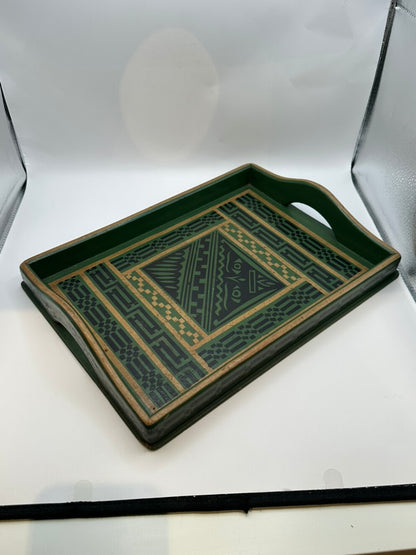 Green wood serving tray angled, showing geometric decoupage center and patterned rim