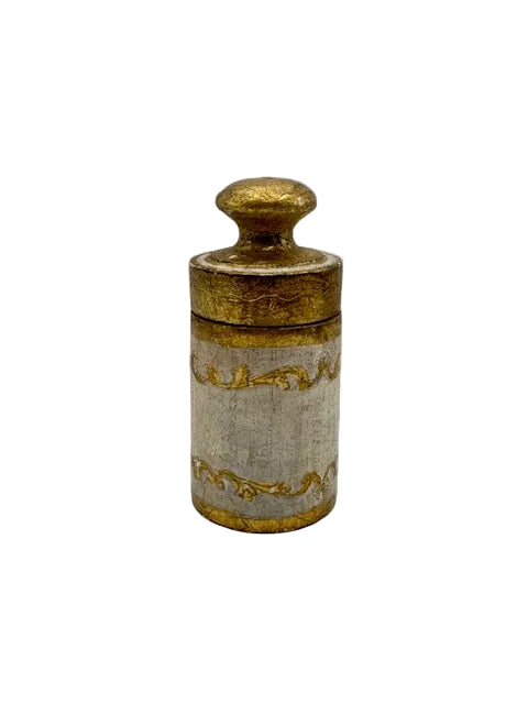 Florentine lidded vanity canister, gilt and cream cylinder with scrollwork bands, front view.