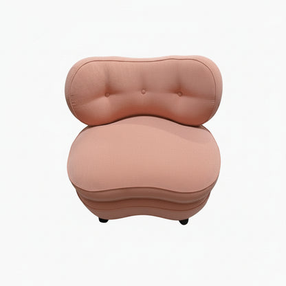 Antique pink coral boudoir chair, kidney-shaped tufted back and rounded seat, studio front view