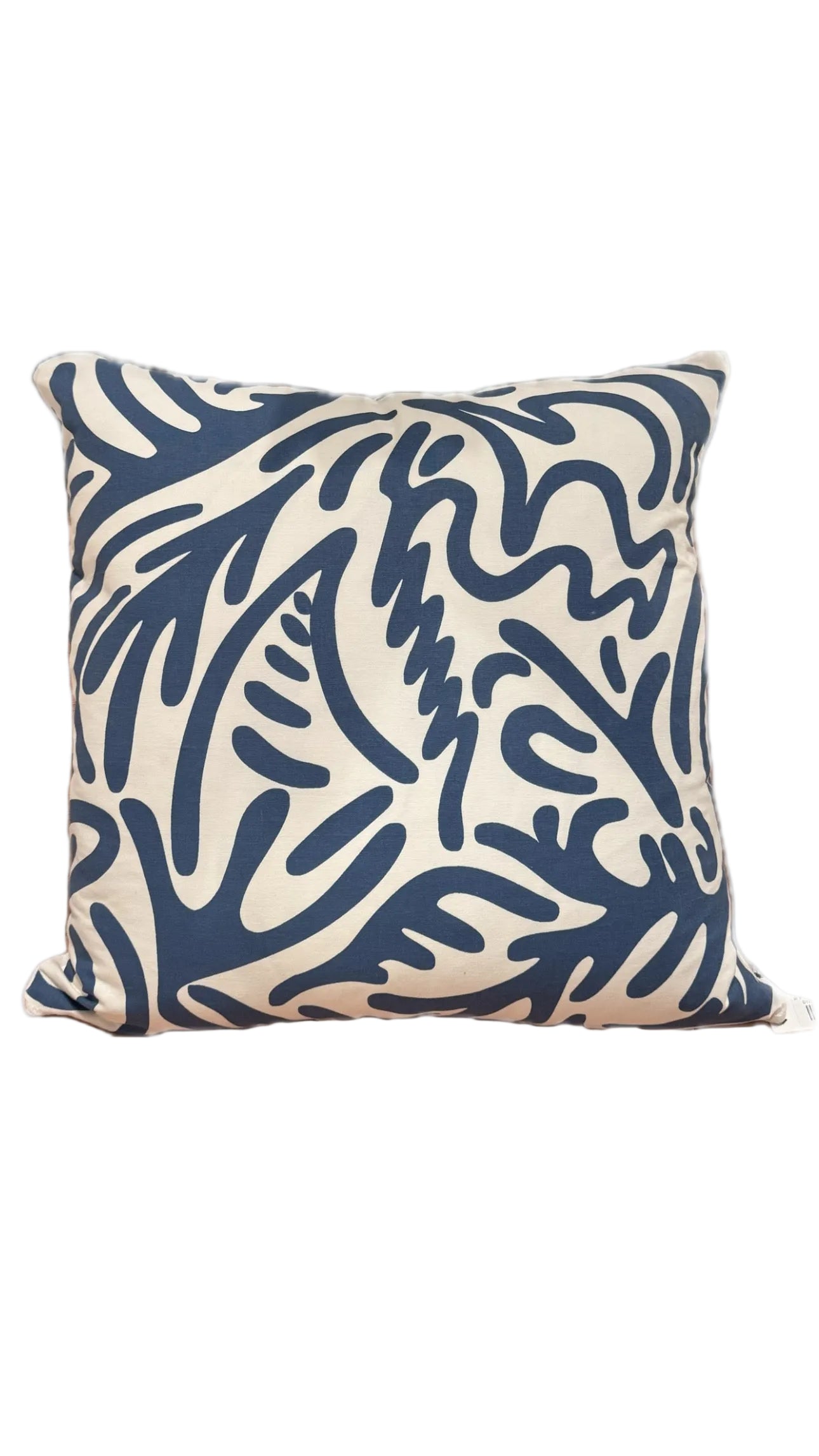 Square throw pillow in cream cotton with a navy blue abstract coral-and-leaf print