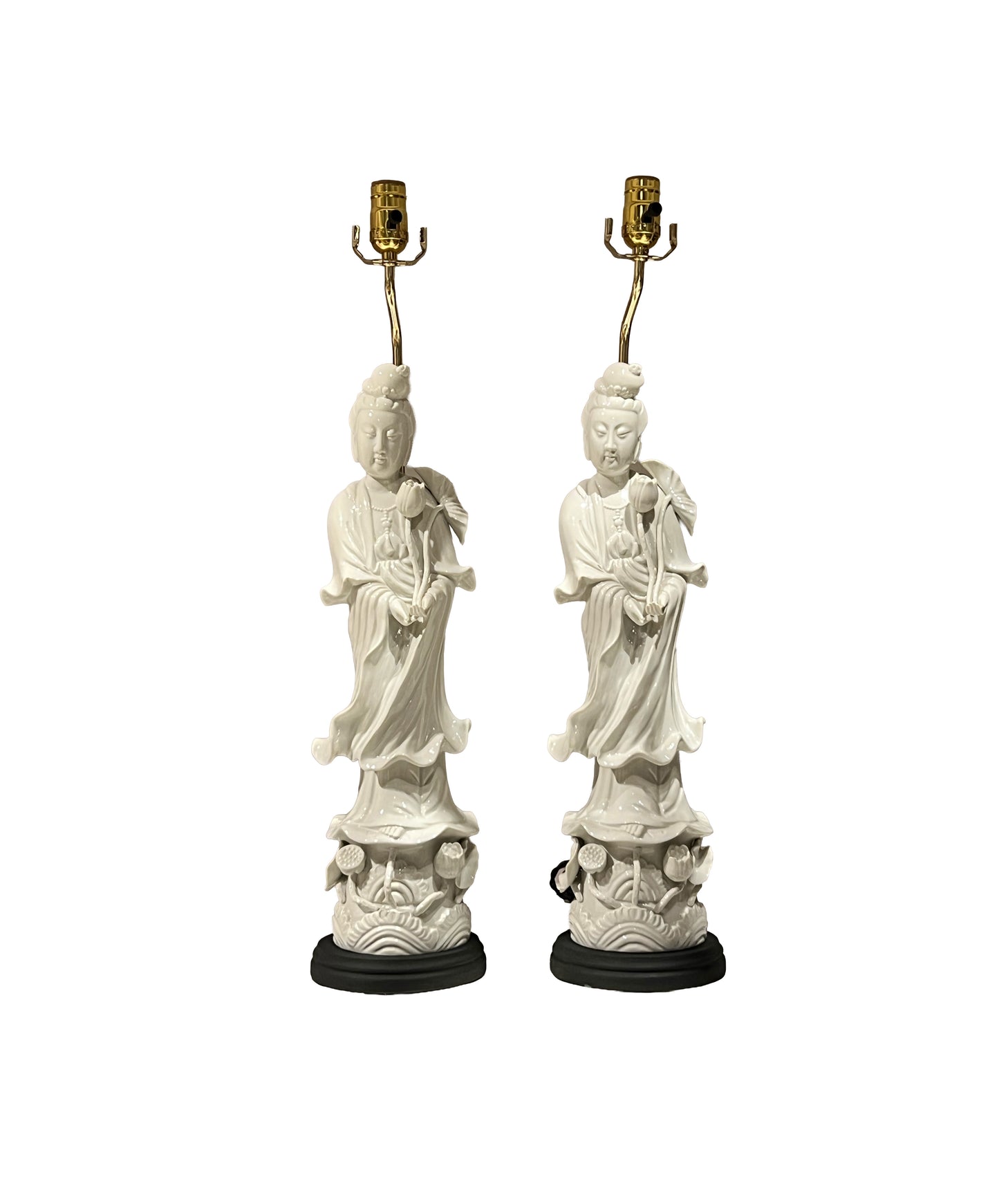 Pair of white porcelain Guanyin figure table lamps, front view with brass sockets